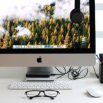 Free Turned on Silver Imac With Might Mouse and Keyboard Stock Photo